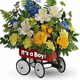 Flower arrangement in a red wagon with "It's a Boy!" text