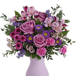 Pink and purple mixed bouquet in a lavender vase