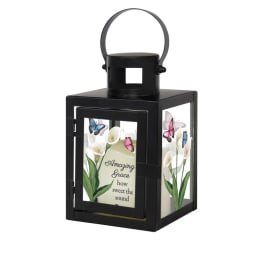 Black lantern with floral panels and the words Amazing Grace
