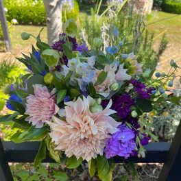 Mixed bouquet with pale pink, purple, blue, and white flowers