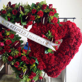 Large red funeral heart wreath with roses and carnations