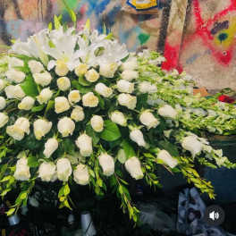 Large white floral spray with roses and lilies