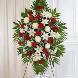 Standing floral spray with red roses, white lilies, and white mums