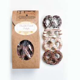 Box of chocolate-covered pretzels with assorted toppings