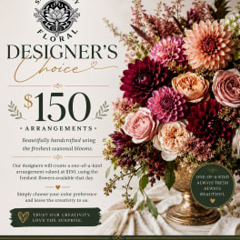 Mixed bouquet of dahlias and roses in a gold vase
