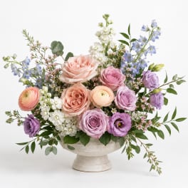 Pastel mixed bouquet in a white pedestal vase