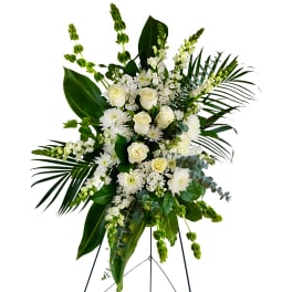 Tall white floral standing spray with roses and chrysanthemums