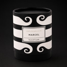 Black and white scented candle in a decorative container