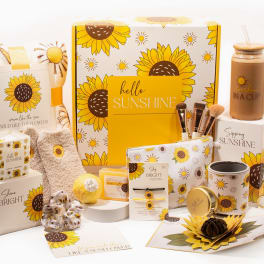 Sunflower-themed gift set with blanket, mug, candle, and accessories