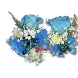 Two blue rose bouquets with white filler flowers and ribbon bows