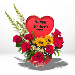 Heart-shaped Mother’s Day arrangement with red roses and sunflowers