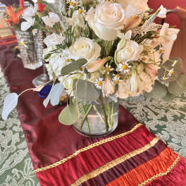 White rose bouquet in a clear glass vase