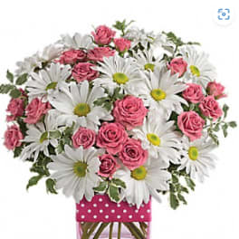 Pink roses and white daisies in a pink polka-dot vase