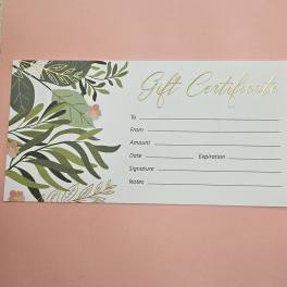 Floral-themed gift certificate card with leafy border on a pink background