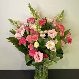 Pink mixed bouquet in a clear glass vase