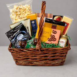Gift basket filled with popcorn, pretzels, and packaged snacks