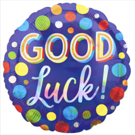 Round purple balloon with colorful polka dots and "GOOD luck!" text