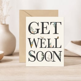 Greeting card reading "GET WELL SOON" with floral accents and a rabbit illustration