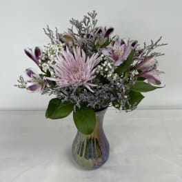 Lavender and white mixed bouquet in a glass vase