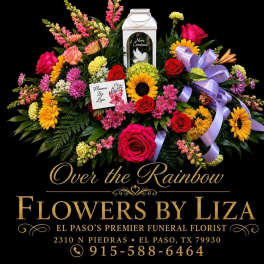 Colorful funeral floral spray with roses, sunflowers, and ribbon on a black background