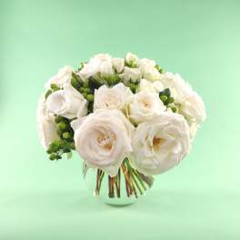 White rose bouquet in a clear glass vase
