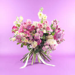 Pink and white rose bouquet with ribbon ties
