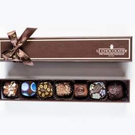 Box of assorted chocolates with a ribbon bow