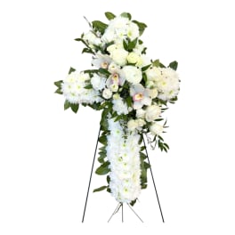 White funeral standing spray on a black easel