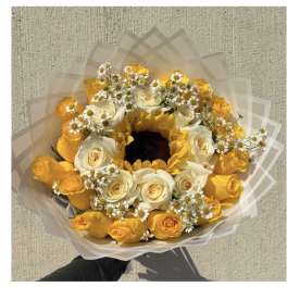 Bouquet of yellow and white roses with small white daisies
