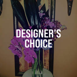 Purple orchid arrangement in a glass vase with designer's choice text