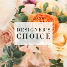 Designer’s choice floral arrangement with peach, pink, and cream blooms