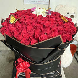 Large bouquet of red roses with white roses and butterfly accents