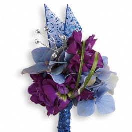 Purple and blue corsage with glittery ribbon accents