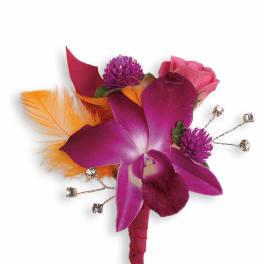 Purple orchid boutonniere with pink rose and orange feathers