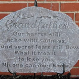 Engraved memorial stone with the word Grandfather and a quote