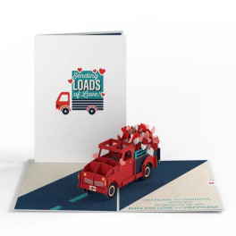 Pop-up greeting card with a red truck and hearts