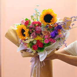 Brown paper wrapped colorful flowers bouquet