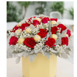 Red roses with gold chocolates in a yellow box