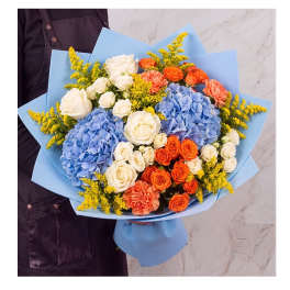 Bouquet of blue hydrangeas, white and orange roses, and yellow filler flowers