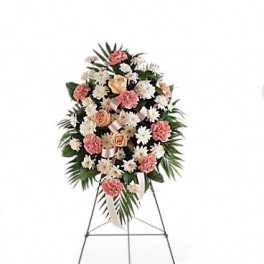 Standing floral spray with pink and white flowers on an easel