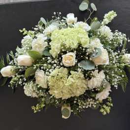 White and pale green floral spray with roses and hydrangeas