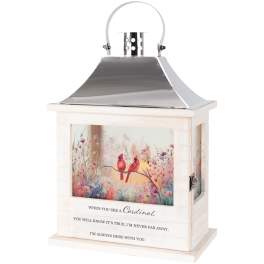 Decorative lantern with cardinal artwork and a memorial quote