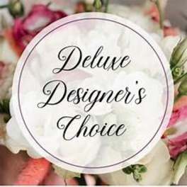 Circular label reading "Deluxe Designer's Choice" over a blurred floral background