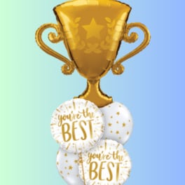 Gold trophy balloon above white balloons with gold text and stars