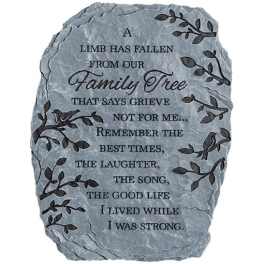 Gray memorial stone with engraved text and leaf designs