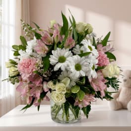 Pink and white mixed bouquet in a clear glass vase