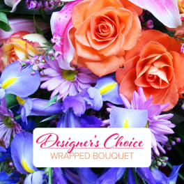 Mixed bouquet of orange roses, pink lilies, and purple flowers