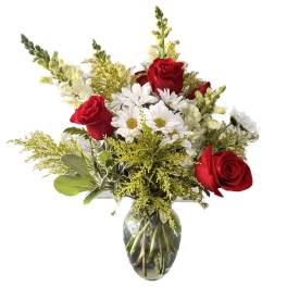Red roses and white daisies in a clear glass vase