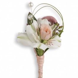 Peach rose and white alstroemeria boutonniere wrapped in blush ribbon with pearl pins