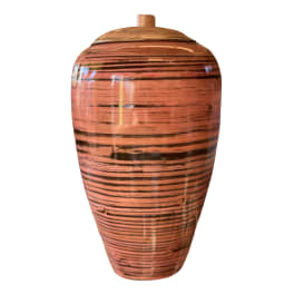 Tall striped ceramic urn vase with a lid